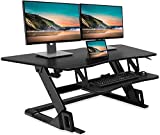 FITUEYES Standing Desk Converter 47 inch Height Adjustable Desk Stand Up Riser for Dual Monitors