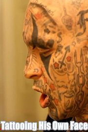 Tattoo artist tattooing his own face!